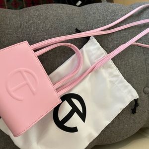 This is an authentic Telfar small bag. I only carried once. Too small. Brand New